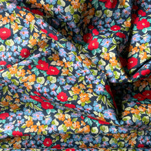 Load image into Gallery viewer, Introducing this beautiful poppy like floral print cotton lawn. Amazing rich vivid colours with red poppy style flowers in various sizes taking centre stage, it also has flowers in blue, lilac and pink, and mustard yellow flowers all against a black background. Cotton lawn is a plain weave textile with a smooth finish, light in weight and also soft to the touch. A great fabric to work with, incredibly versatile and would suit dresses and blouses. 
