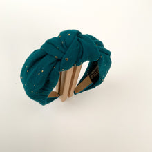 Load image into Gallery viewer, Introducing a wonderful collection of hairbands created by the lovely Northstar Needlework brand. All the knotted top hairbands are handmade with a double layer of beautiful fabric. This particular design has gold speckles across a rich forrest green background.
