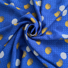 Load image into Gallery viewer, beautiful Viscose fabric with various circled with different prints and colours such as, yellow, white and navy against a blue background. Viscose fabric is a semi-synthetic type of Rayon, made from wood pulp it gives a smooth silk like finish and has a light weight fabric which drapes well across the body. it has no stretch but a lovely sewing fabric that works well with a number of amazing sewing patterns, such as the Avid Seamstress blouse or the Nina Lee Kew Dress.
