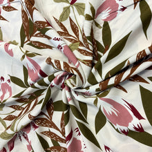 Load image into Gallery viewer, A beautiful floral daylily inspired viscose fabric. The main colours on the fabric are brown and soft pink with other neutral colours, giving it a relaxed finish. Viscose fabric is a semi-synthetic type of Rayon, made from wood pulp it gives a smooth silk like finish and as a light weight fabric will drape well across the body. It makes it an ideal sewing fabric because of it’s versatility, and perfect for a number of sewing projects, including dresses, skirts, blouses and summer trousers to name a few. 
