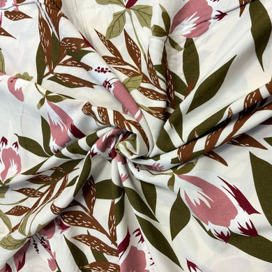 A beautiful floral daylily inspired viscose fabric. The main colours on the fabric are brown and soft pink with other neutral colours, giving it a relaxed finish. Viscose fabric is a semi-synthetic type of Rayon, made from wood pulp it gives a smooth silk like finish and as a light weight fabric will drape well across the body. It makes it an ideal sewing fabric because of it’s versatility, and perfect for a number of sewing projects, including dresses, skirts, blouses and summer trousers to name a few. 