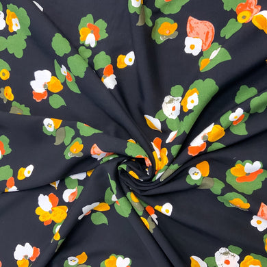 A beautiful floral motif design which includes colours such as yellow, orange and red against a black background. Viscose fabric is a semi-synthetic type of Rayon, made from wood pulp it gives a smooth silk like finish and as a light weight fabric will drape well across the body. It makes it an ideal sewing fabric because of it’s versatility, and perfect for a number of sewing projects, including dresses, skirts, blouses and light trousers to name a few. 