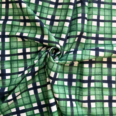 A beautiful checked cotton lawn sewing fabric, from the wonderful KOKKA Fabrics. It has a subtle wavy black lines crossing water colour like green lines against a white background. A soft, light weight fabric, with a bit of structure to it, making it easy to handle especially if you are early into your sewing journey. 