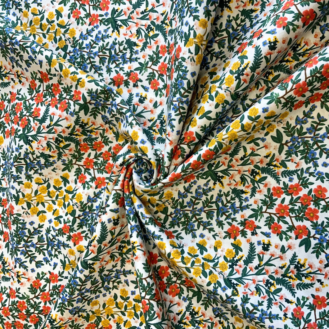 Introducing the Camont Wildwood Garden white in cotton by Rifle Paper Co. A beautiful floral design with a wonderful range of bright rich colours. The 100% cotton fabric is versatile and ideal for creating garments, quilts, and accessories.