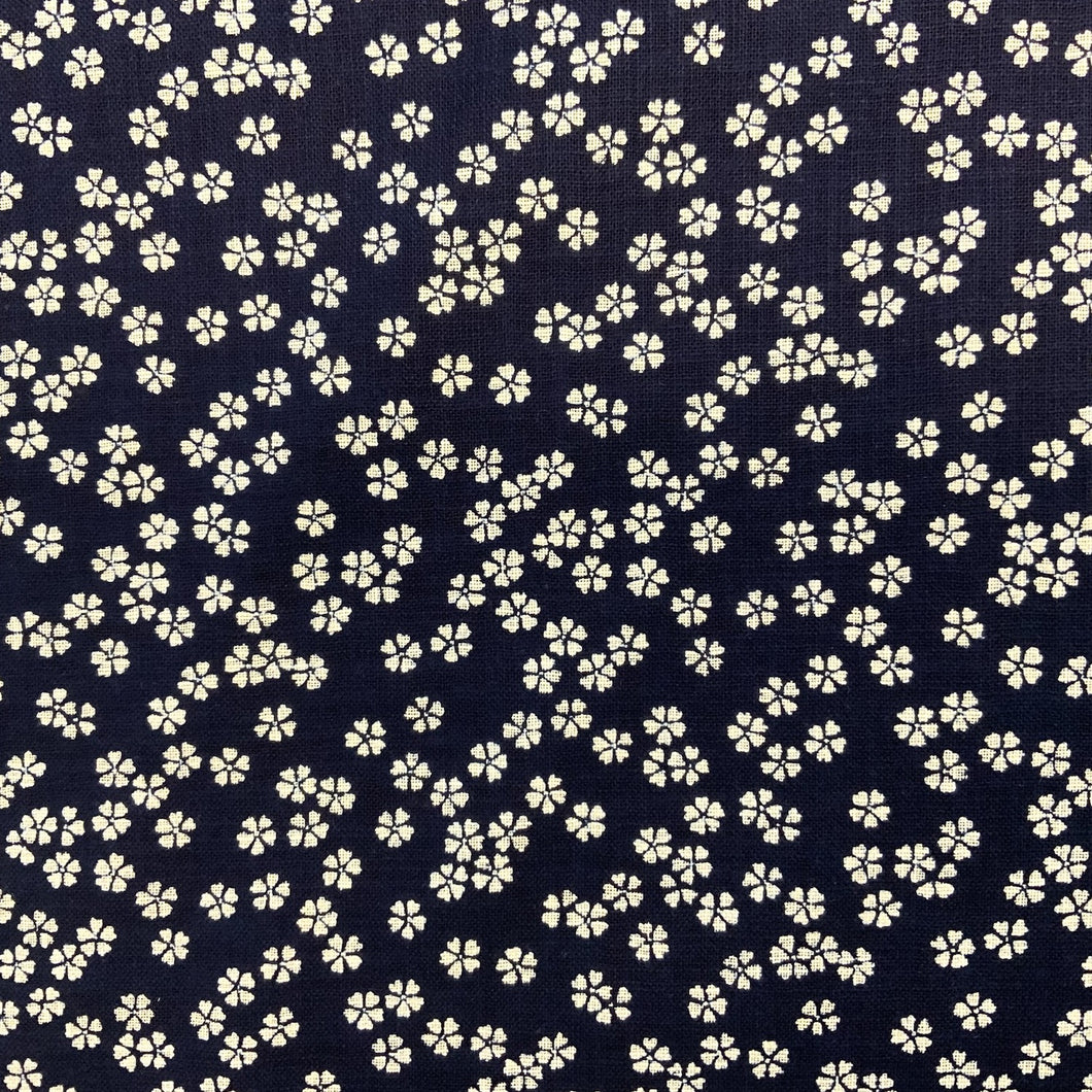 Introducing this wonderful cotton poplin fabric designed by Sevenberry Nara Homespun. The deep navy and cream colour homespun printed cotton fabric features a traditional Japanese design with little daisy inspired motifs and is perfect for dressmaking, crafts and light furnishings.