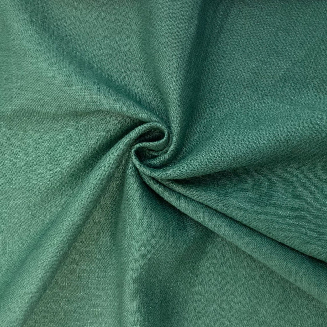 This is a wonderful Forrest Green washed linen fabric. Washed linen means fabric which has been washed already to reduce shrinkage and provide additional softness. The fabric quality is lovely, with a strong sturdy handle but still provides some drape across the body. Linen is a great fabric to use because it feels light and is  breathable. It is an ideal dressmaking fabric for clothing such as dresses, skirts, trousers but also decorative purposes too.
