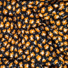 Load image into Gallery viewer, Floral Viscose sewing fabric to buy with yellow and white flowers on a black background
