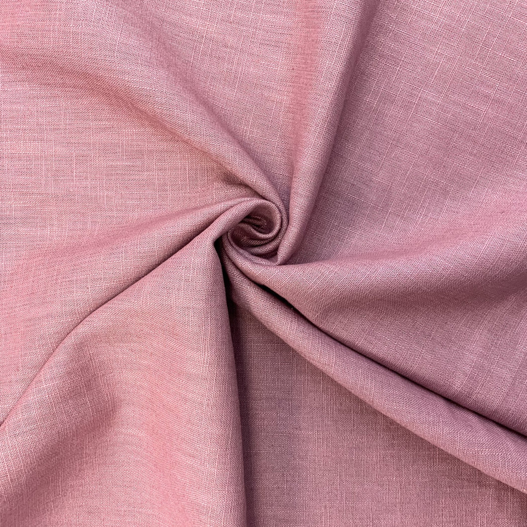 This is a wonderful mauve washed linen fabric. Washed linen means fabric which has been washed already to reduce shrinkage and provide additional softness. The fabric quality is lovely, with a strong sturdy handle but still provides some drape across the body. Linen is a great fabric to use because it feels light and is  breathable. It is an ideal dressmaking fabric for clothing such as dresses, skirts, trousers but also decorative purposes too.