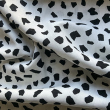 Load image into Gallery viewer, This is a wonderful linen and viscose fabric, with a monochrome abstract deisgn. The fabric quality is lovely, with a strong sturdy handle but still provides some drape across the body. As it has a 45% viscose content it creases less but has the look and feel of linen, making it light and breathable. With the combined mix of fabric yarns it is an ideal dressmaking fabric for clothing such as dresses, skirts, trousers but also decorative purposes too.
