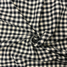 Load image into Gallery viewer, Introducing this amazing designer deadstock checked black and off white deadstock fabric which is Incredibly soft cotton flannel. Gingham fabric is instantly recognisable and a firm favourite for many especially during the spring and summer months, but also popular into Autumn. Known for its checked patterns of white and a bold colour. 
