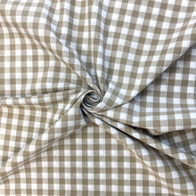 Load image into Gallery viewer, A lovely Sand and white checked fabric. Gingham fabric is instantly recognisable and a firm favourite for many especially during the spring and summer months, but also popular into Autumn. Known for its checked patterns of white and a bold colour. It is extremely versatile, a great sewing fabric which can be used for shirts, dresses, craft and lightweight furnishing uses.  The checks are 10mm and appear in horizontal rows and vertical columns.
