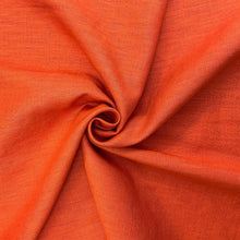 Load image into Gallery viewer, This is a wonderful orange washed linen fabric. Washed linen means fabric which has been washed already to reduce shrinkage and provide additional softness. The fabric quality is lovely, with a strong sturdy handle but still provides some drape across the body. Linen is a great fabric to use because it feels light and is  breathable. It is an ideal dressmaking fabric for clothing such as dresses, skirts, trousers but also decorative purposes too.
