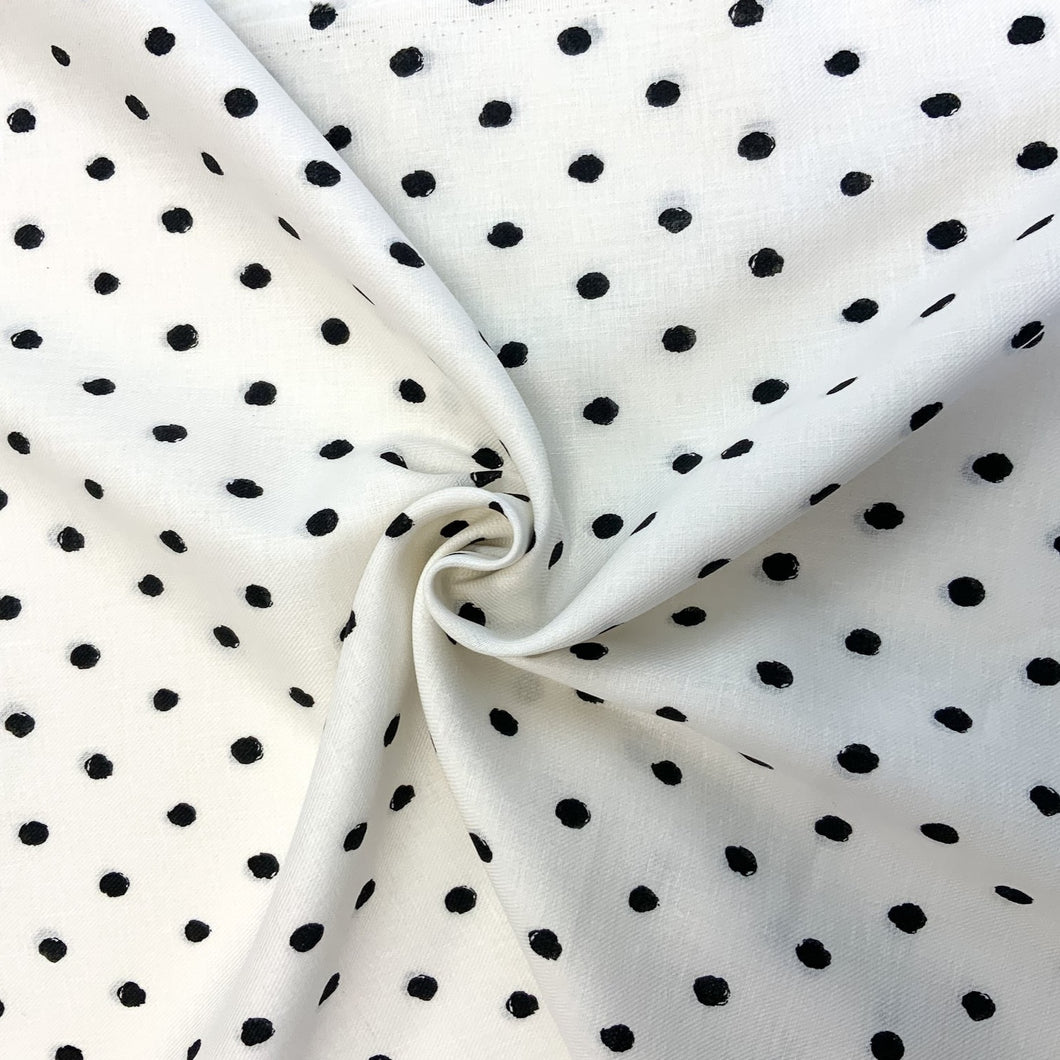 Featuring circles with a sketch effect against a white background. The cotton twill design is simple yet elegant and by mixing cotton and linen together you get a soft, drapey, absorbent, breathable and extremely comfortable fabric. With the combined mix of fabric yarns it is an ideal dressmaking fabric for clothing such as dresses, skirts, trousers but also decorative purposes too.