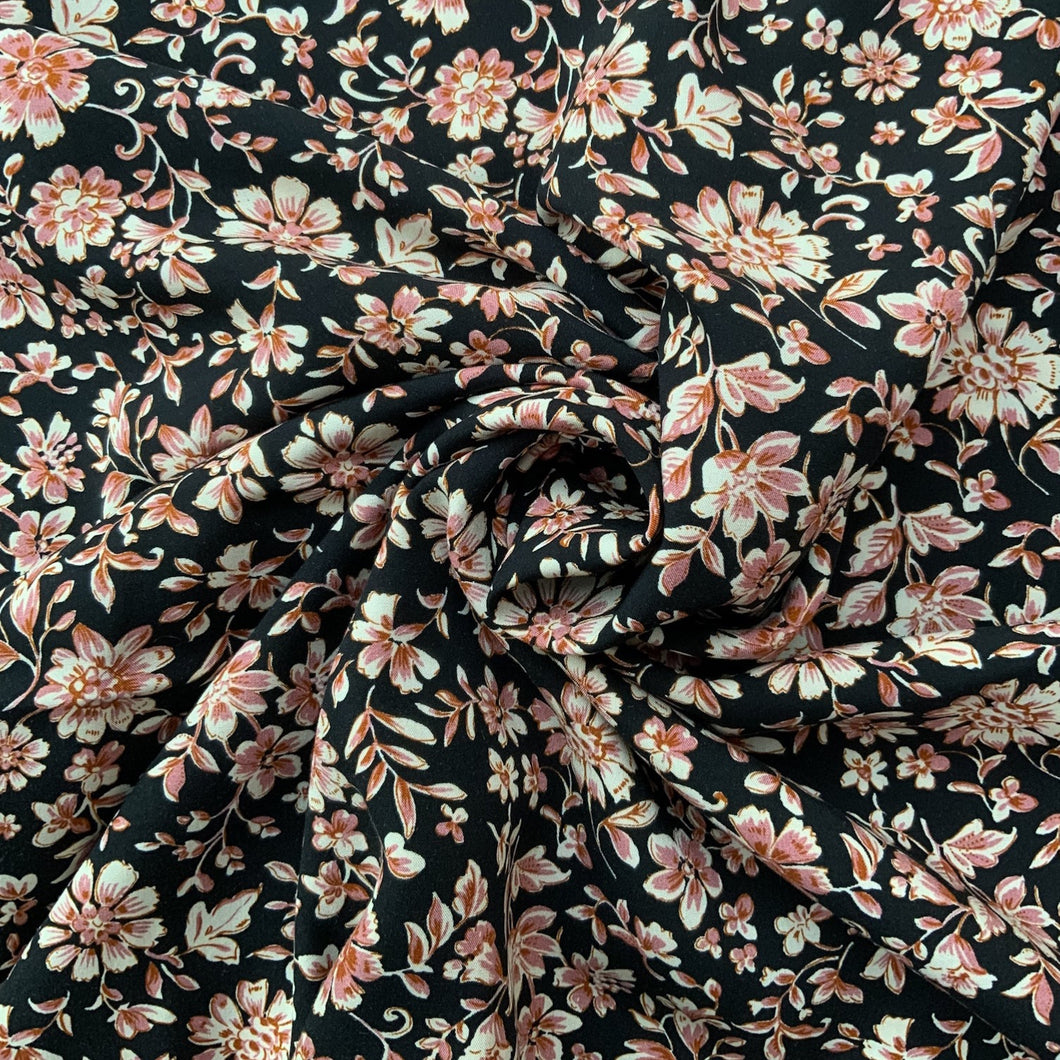 We have this light weight viscose fabric with a vintage inspired floral print, with colours such as a light brown with deep rose and off white flowers against a black background. Viscose fabric is a semi-synthetic type of Rayon, made from wood pulp it gives a smooth silk like finish and as a light weight fabric will drape well across the body. It makes it a versatile sewing fabric as it can be used for a number of sewing projects, including dresses, skirts, blouses and light weight trousers to name a few.  