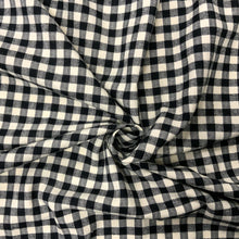 Load image into Gallery viewer, Introducing this amazing designer deadstock checked black and off white deadstock fabric which is Incredibly soft cotton flannel. Gingham fabric is instantly recognisable and a firm favourite for many especially during the spring and summer months, but also popular into Autumn. Known for its checked patterns of white and a bold colour. 
