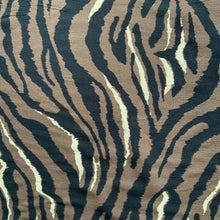 Load image into Gallery viewer, A lovely dressmaking fabric with an animal print design. Zebra like stripes in black, brown and white. Viscose fabric is a semi-synthetic type of Rayon, made from wood pulp it gives a smooth silk like finish and as a light weight fabric will drape well across the body
