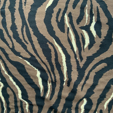 A lovely dressmaking fabric with an animal print design. Zebra like stripes in black, brown and white. Viscose fabric is a semi-synthetic type of Rayon, made from wood pulp it gives a smooth silk like finish and as a light weight fabric will drape well across the body