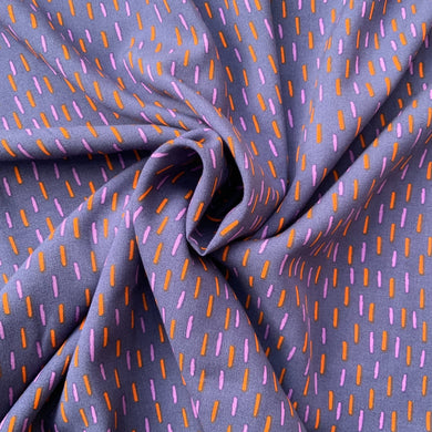 We have this light weight viscose fabric with light purple and orange dashes against a dark purple background. Viscose fabric is a semi-synthetic type of Rayon, made from wood pulp it gives a smooth silk like finish and as a light weight fabric will drape well across the body. It makes it a versatile sewing fabric as it can be used for a number of sewing projects, including dresses, skirts, blouses and light weight trousers to name a few.  
