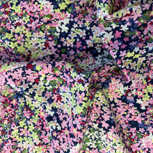 Load image into Gallery viewer, A cotton lawn sewing fabric that features beautiful daisy like flowers in colours including pink, yellow, blue and peach just to name a few. Cotton Lawn is a plain weave textile, with a crisp finish, it also has an added bonus of being extremely light weight, with a smooth silk like touch

