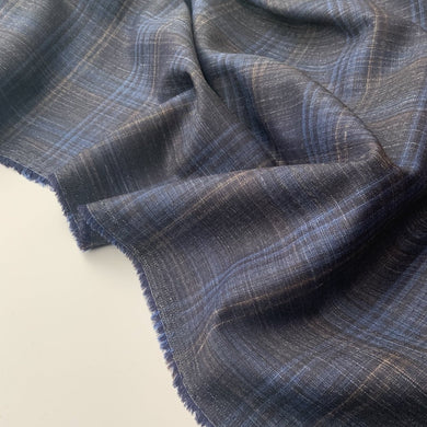 This is a wonderful Wool, Silk and linen mix fabric with a soft drape. Colours include Navy, Blue, and White in a checks design