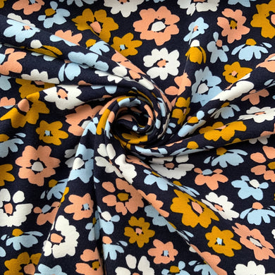 A lovely bright and soft floral jersey fabric with wonderful colours in yellow, white, light blue and peach with contrasting colours in the centre of each flower. Made from a lovely high quality organic cotton jersey fabric. A luxurious soft and comfy stretchy jersey fabric with a great weight, a perfect quality for sweatshirts, hoodies, pants and dresses.