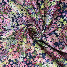 Load image into Gallery viewer, A wonderful cotton lawn fabric that features beautiful daisy like flowers in colours including pink, yellow, blue and peach just to name a few. Cotton Lawn is a plain weave textile, with a crisp finish, it also has an added bonus of being extremely light weight, with a smooth silk like touch

