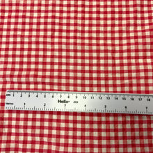 Load image into Gallery viewer, Introducing this amazing Italian deadstock sewing fabric. A lovely deep pink and white fabric. Gingham fabric is instantly recognisable and a firm favourite for many especially during the spring and summer months, but also popular into Autumn. Known for its checked patterns of white and a bold colour. Seersucker is a summery cotton fabric which has a puckered surface due to the alternate tight and loose yarns in the weaving process.
