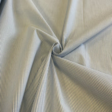 Load image into Gallery viewer, Introducing this amazing Italian deadstock sewing fabric. A simple design but lovely quality light blue and white striped cotton fabric. The stripes are narrow with a slight embossed texture to the fabric surface. A great fabric which can be sewn up into something smart or casual, It is extremely versatile, a great sewing fabric which can be used for shirts, dresses, craft and lightweight furnishing uses.
