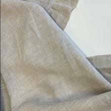 Load image into Gallery viewer, Introducing this amazing Italian deadstock sewing fabric. A lovely quality oatmeal coloured linen fabric. Linen is a great fabric to use because it feels light and is breathable. It is an ideal dressmaking material for clothing such as dresses, skirts, trousers but also decorative purposes too..
