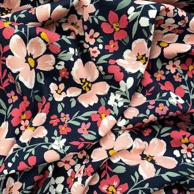 Cherry Blossom Stretch Viscose with oink and white cherry blossom style flowers on a navy background