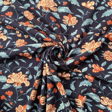 beautiful bamboo and cotton jersey sewing fabric with passion flowers vine inspired print. With lovely rust coloured flowers in full bloom or partially open, along with light blue and white leaves and stems against a deep navy background. The fabric has a good stretch and will be great to sew tops, dresses and sweatshirts.  
